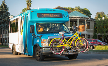 propane transit bus with bike rack attached